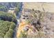 An aerial view showing wooded lot with new construction next to an older homesite and offering a private and peaceful setting at 835 Old Brock Rd, Rockmart, GA 30153