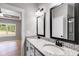 Bathroom with double vanity, granite countertop and framed mirrors at 835 Old Brock Rd, Rockmart, GA 30153