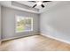 Bright bedroom featuring a trey ceiling, and a window with a view of the yard at 835 Old Brock Rd, Rockmart, GA 30153