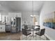 Kitchen and dining area with stainless steel appliances and glass dining table at 835 Old Brock Rd, Rockmart, GA 30153