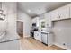 Modern kitchen with stainless steel appliances, granite countertops, and sleek black hardware at 835 Old Brock Rd, Rockmart, GA 30153