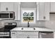 Modern kitchen with white shaker cabinets and granite countertops at 835 Old Brock Rd, Rockmart, GA 30153