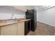 Kitchen with stainless steel sink and beige cabinets at 1501 Clairmont Rd # 223, Decatur, GA 30033