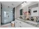 Elegant bathroom with double vanity, granite countertop, and a glass shower at 418 Kenley Ct, Mcdonough, GA 30253