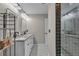Double vanity bathroom with a large tiled shower at 418 Kenley Ct, Mcdonough, GA 30253