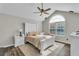 Spacious bedroom with vaulted ceiling, large window, and neutral decor at 418 Kenley Ct, Mcdonough, GA 30253
