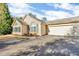 Inviting exterior with stone accents and a two-car garage at 418 Kenley Ct, Mcdonough, GA 30253