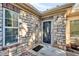 Stone exterior with welcoming front entry and landscaping at 418 Kenley Ct, Mcdonough, GA 30253