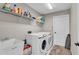 Laundry room with washer, dryer, and utility sink at 418 Kenley Ct, Mcdonough, GA 30253