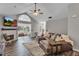 Bright living room featuring a fireplace and sunroom access at 418 Kenley Ct, Mcdonough, GA 30253