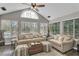 Sunroom with windows and comfortable seating at 418 Kenley Ct, Mcdonough, GA 30253
