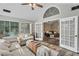 Bright sunroom featuring multiple windows and comfortable seating at 418 Kenley Ct, Mcdonough, GA 30253