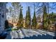 Large concrete patio area with surrounding trees and fence at 1496 Sweet Bottom Sw Cir, Marietta, GA 30064