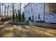 Brick home with large backyard, patio, retaining wall, and landscaping at 1496 Sweet Bottom Sw Cir, Marietta, GA 30064