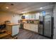 Basement kitchenette with granite countertops and white cabinets at 1496 Sweet Bottom Sw Cir, Marietta, GA 30064