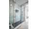 Bathroom with a large walk-in shower and marble tile at 1496 Sweet Bottom Sw Cir, Marietta, GA 30064
