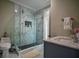 Bathroom with a large walk-in shower and marble tile at 1496 Sweet Bottom Sw Cir, Marietta, GA 30064