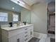 Double vanity bathroom with white cabinets and a large mirror at 1496 Sweet Bottom Sw Cir, Marietta, GA 30064