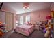 Charming bedroom with pink walls and a comfortable bed at 1496 Sweet Bottom Sw Cir, Marietta, GA 30064