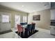 Modern dining area featuring a glass-top table and velvet chairs at 1496 Sweet Bottom Sw Cir, Marietta, GA 30064