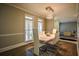 Bright dining room with white chairs and a modern chandelier at 1496 Sweet Bottom Sw Cir, Marietta, GA 30064