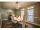 Elegant dining room featuring a white table, chandelier, and hardwood floors at 1496 Sweet Bottom Sw Cir, Marietta, GA 30064