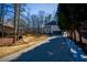 Long driveway leading to a two-story brick home at 1496 Sweet Bottom Sw Cir, Marietta, GA 30064