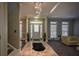 Bright entryway with marble floors and chandelier at 1496 Sweet Bottom Sw Cir, Marietta, GA 30064