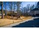 Landscaped yard with a two story home and trees at 1496 Sweet Bottom Sw Cir, Marietta, GA 30064