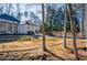 Brick home nestled amongst mature trees on a sloping lot at 1496 Sweet Bottom Sw Cir, Marietta, GA 30064