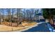 Two-story brick home with a large driveway and landscaped yard at 1496 Sweet Bottom Sw Cir, Marietta, GA 30064