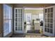 Home office with built-in shelving and French doors at 1496 Sweet Bottom Sw Cir, Marietta, GA 30064
