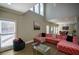 Open living room with sectional sofa, high ceilings, and natural light at 1496 Sweet Bottom Sw Cir, Marietta, GA 30064