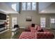 Large living room with a sectional sofa, fireplace, and high ceilings at 1496 Sweet Bottom Sw Cir, Marietta, GA 30064
