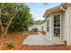 Cozy backyard patio area with lush landscaping and outdoor access at 407 Red Coat Ln, Woodstock, GA 30188