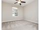 Bedroom features neutral walls and carpet at 407 Red Coat Ln, Woodstock, GA 30188