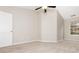 Bedroom featuring new carpeting, neutral walls, window, and ceiling fan at 407 Red Coat Ln, Woodstock, GA 30188