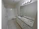 Bathroom with granite vanity and updated fixtures at 4620 Cedar Brook Se Dr, Conyers, GA 30094