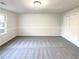 Bright bedroom with neutral walls and carpet at 4620 Cedar Brook Se Dr, Conyers, GA 30094