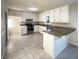 Kitchen with granite countertops and updated appliances at 4620 Cedar Brook Se Dr, Conyers, GA 30094