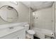 Bathroom with a modern vanity, updated shower, and decorative tile at 5076 Furlong Way, Powder Springs, GA 30127