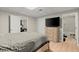 Bedroom featuring a bed, dresser, hardwood floors and ensuite bathroom at 5076 Furlong Way, Powder Springs, GA 30127