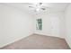 Spacious bedroom with ceiling fan and neutral colored carpet at 718 Surrey Park Se Pl, Smyrna, GA 30082