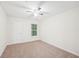 Spacious bedroom with ceiling fan and neutral colored carpet at 718 Surrey Park Se Pl, Smyrna, GA 30082