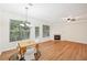 Bright dining area with hardwood floors and chandelier, adjacent to kitchen at 718 Surrey Park Se Pl, Smyrna, GA 30082