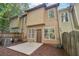 Townhouse exterior with patio and wooded views at 718 Surrey Park Se Pl, Smyrna, GA 30082