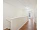 Upstairs hallway with access to bedrooms and ample light at 718 Surrey Park Se Pl, Smyrna, GA 30082