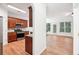 Open kitchen with dark wood cabinets and granite countertops at 718 Surrey Park Se Pl, Smyrna, GA 30082