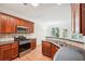 Modern kitchen with island, stainless steel appliances, and view to dining area at 718 Surrey Park Se Pl, Smyrna, GA 30082