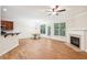 Spacious living room featuring hardwood floors, fireplace and lots of natural light at 718 Surrey Park Se Pl, Smyrna, GA 30082
